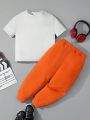 SHEIN Kids HYPEME Boys' Cute And Comfortable Cartoon English Pattern Short Sleeve Top With Knitted Pants Set