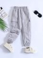 SHEIN Kids EVRYDAY Young Boy Light Grey Solid Color Casual Comfortable Mult-pocket Classic Pants/shorts, Suitable For Summer Or Autumn