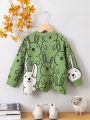 SHEIN Kids QTFun Toddler Girls' Cartoon Rabbit Pattern Irregular Hem Sweater