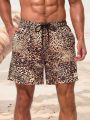 SHEIN Men's Leopard Print Beach Shorts With Slanted Pockets