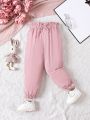 SHEIN Kids QTFun Little Girls' Solid Paper Bag Waist Casual Pants With Bowknot Detail And Color Blocking