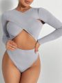 SHEIN BAE Solid Criss Cross Cut Out Bodysuit